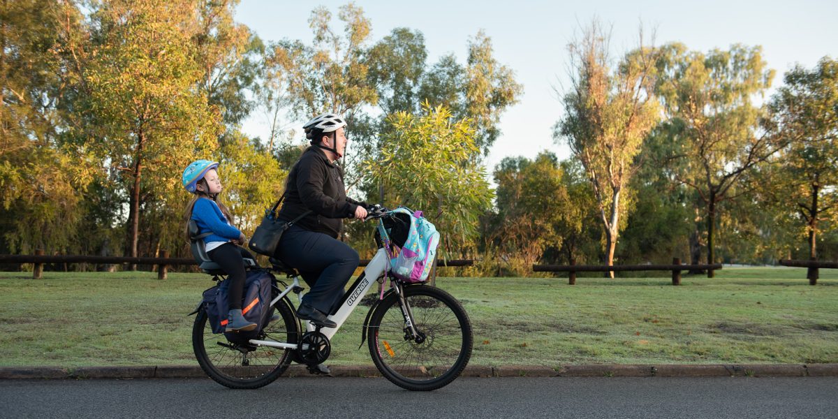 woman and child on an e-bike